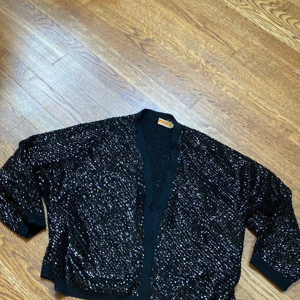 This is an amazing black sequined and wool short sweater